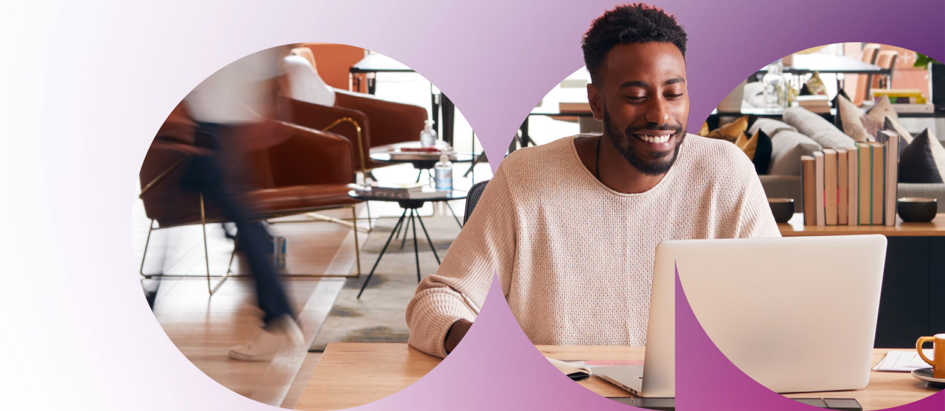 Uomo che sorride mentre lavora al laptop