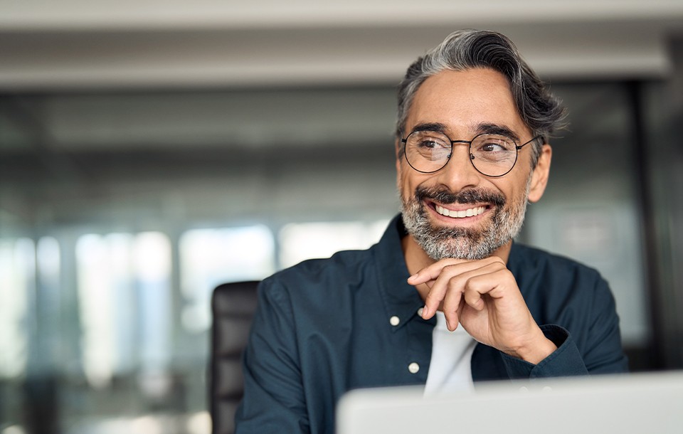 Man using a laptop at work